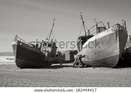 Old broken ships on a sandy coast