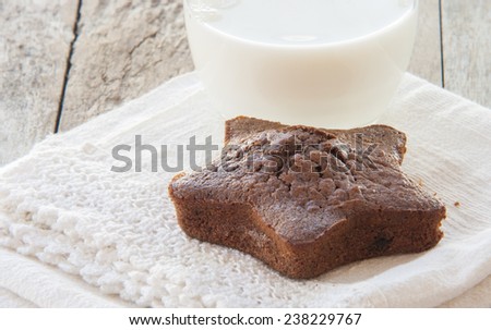 Star-shaped gingerbread cake with glass of milk