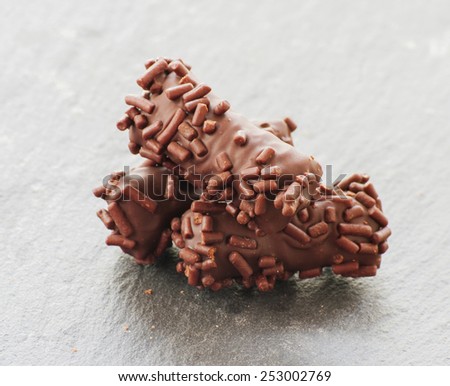 Truffle candy coated chocolate with decorative powdered for the occasion
