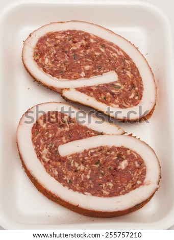 raw pork Meat Loaf with spices on white