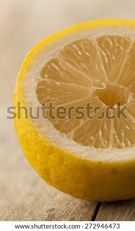 lemon cut close up on wooden background