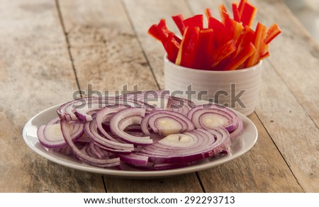 cut red pepper and red onion ready to cook