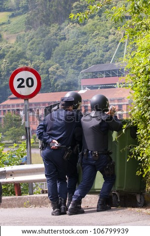 SOTON COALMINE, SPAIN - JUNE 4:  Anti riot police agents of the Police National Corp filming miners  on June 4th 2012 in coalmine Soton, Spain.