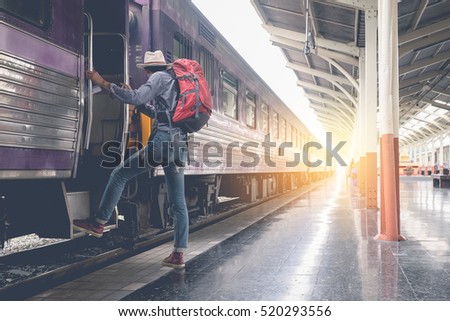 Young traveler with backpack in the railway. vintage effected photo. Travel concept