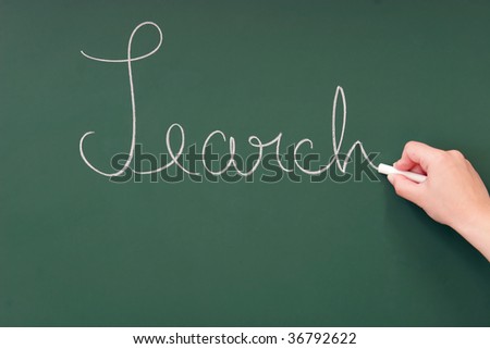 Search written on a blackboard with chalk