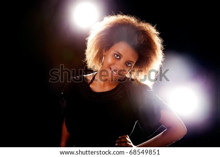 beautiful black  woman, smiling, isolated on black background