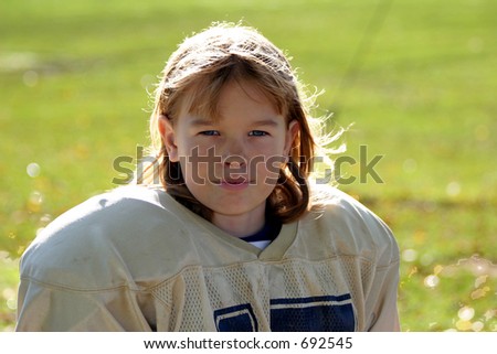 Young Blond Girl in Football Uniform