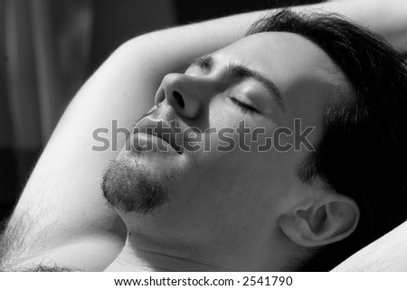 Young Man Lying in the sun, photo in black and white