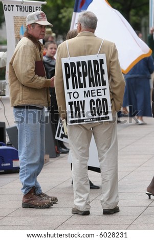 Christian Protesters Carrying Signs