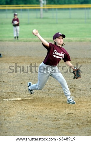 Young Girl Pitching Baseball