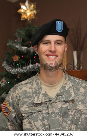Young American ARMY Soldier in Uniform home for the Holidays