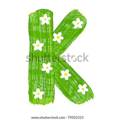 stock photo : The green letters K drawn by paints with white blossom