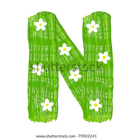stock photo : The green letters N drawn by paints with white blossom