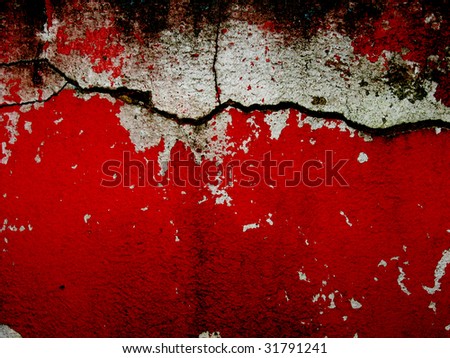cracked bright red and white wall