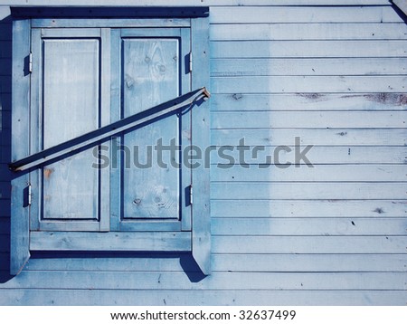 vintage wooden wall with a locked window