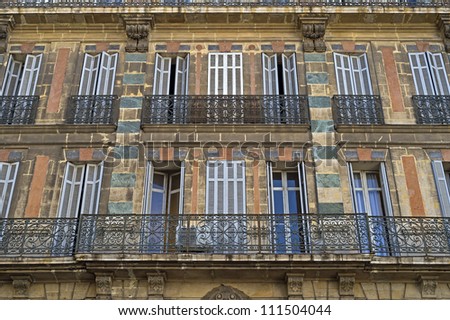 The front of a historic palace house in the quarter \
