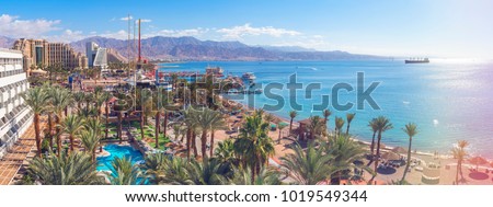 Central public beach and marina in Eilat - famous resort and recreation city in Israel. This serene location is a very popular tropical getaway for Israeli and European tourists