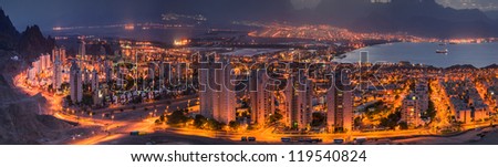 Panoramic spectacular view on the night cities of Eilat (Israel) and Aqaba (Jordan)