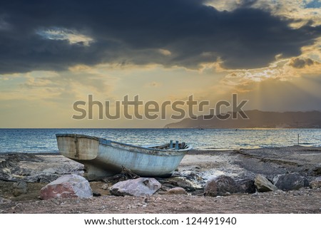 Old fishing boat after storm at the gulf of Aqaba, Eilat, Israel