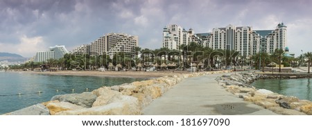 View on the central beach of Eilat from marine pier. Eilat is a famous tourist Israeli city with beautiful tropical beaches and resort hotels