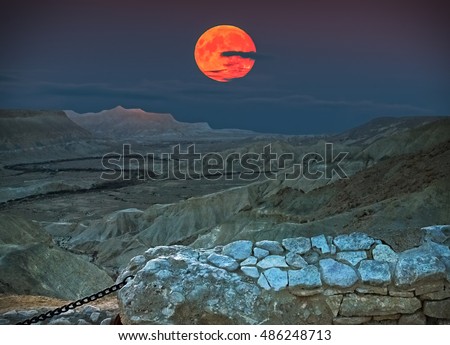 Rise of the super moon in desert of the Negev, Israel