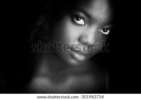 low key lighting of a black american female