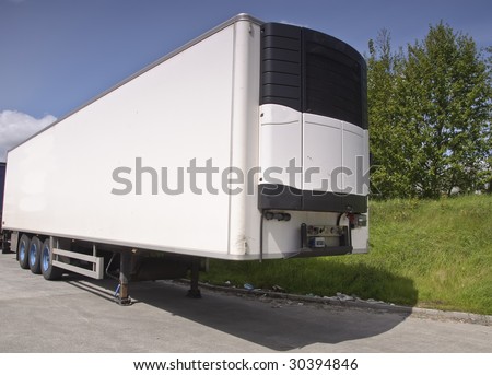 large modern refrigerated truck trailer freight, place advert on white