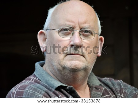 portrait of an older unshaven male