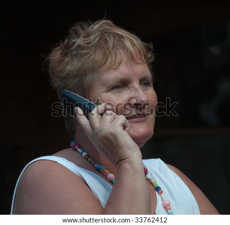 close portrait of senior lady on phone