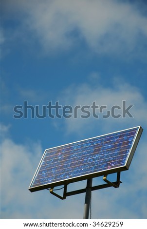 picture  solar panel against cloudy blue sky
