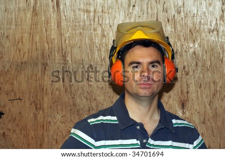 picture of male wearing safety hat, glasses and ear protection