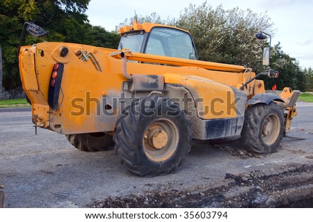 industrial construction forklift in yellow outside