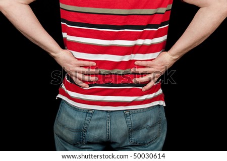 photo male with lower back pain on black