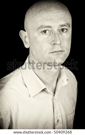 photo male in his 30\'s in shirt on black back drop