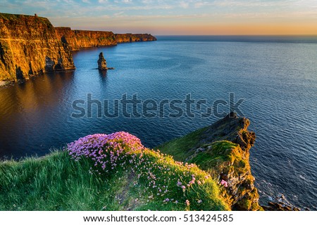 Ireland countryside tourist attraction in County Clare. The Cliffs of Moher and castle Ireland. Epic Irish Landscape  Seascape along the wild atlantic way. Beautiful scenic nature hdr Ireland.