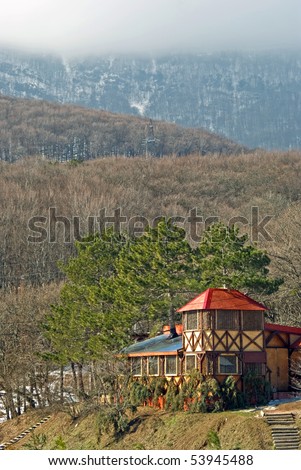 shooting house in forest at the foot of mountain