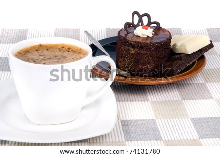 coffee with cake on textile mat