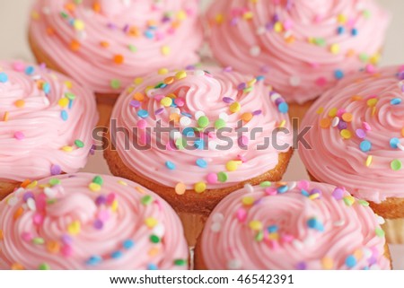 stock photo Closeup of lots of pretty pink cupcakes