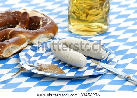 Close-up of food at Oktoberfest with pretzel, weisswurst and beer in beer stein