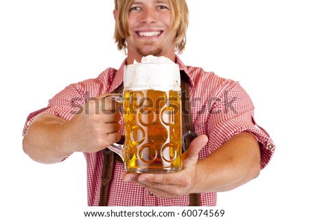 stock photo : Happy smiling man with leather trousers (lederhose) holds oktoberfest beer stein. Isolated on white background.