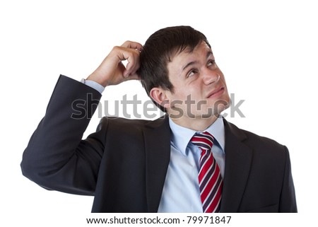Businessman scratches his head and looks up thoughtfully.Isolated on white background.