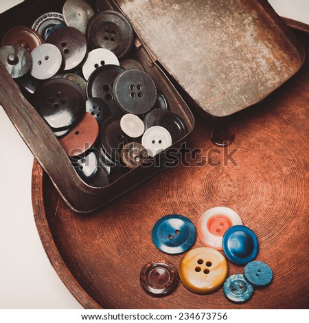 Retro collection of vintage buttons in the old iron box