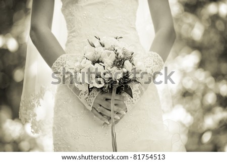wedding bouquet in the hands of the bride