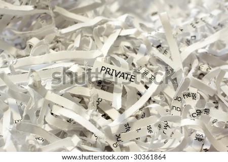 A pile of shredded or destroyed business documents labeled private