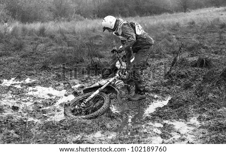 SUDBURY, ENGLAND - NOVEMBER 27: Unidentified competitors get stuck in mud during an Enduro race on November 27, 1977 in Sudbury, Suffolk. The sport involves timed stages on off road terrain.