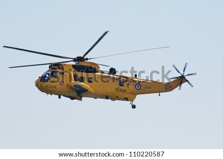 EASTBOURNE, ENGLAND - AUGUST 11: A Westland Sea King HAR3 helicopter of the RAF Search and Rescue squadron, performs at the Airbourne airshow on August 11, 2012 at Eastbourne, East Sussex.