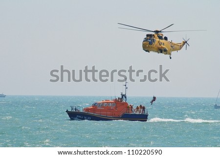 EASTBOURNE, ENGLAND - AUGUST 11: A Westland Sea King HAR3 helicopter of the RAF Search and Rescue squadron, demonstrates at the Airbourne airshow on August 11, 2012 at Eastbourne, East Sussex.