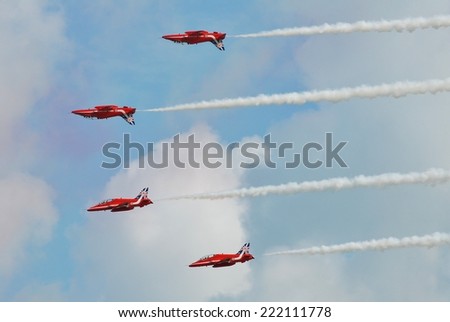 EASTBOURNE, ENGLAND - AUGUST 14, 2014: RAF aerobatic display team The Red Arrows perform at the annual Airbourne airshow. Formed in 1965, the team are in their 50th display season.
