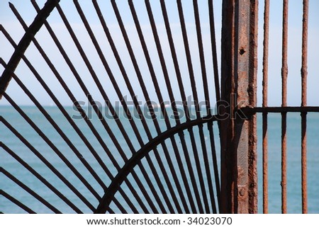 The metal spokes of a barrier at the end of the harbour wall in Folkestone, Kent, England.