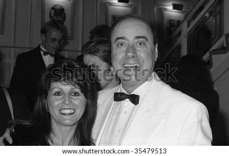 LONDON-OCTOBER 18: Victor Spinetti, Welsh actor and performer, with unknown female, at a celebrity event on October 18, 1990 in London.He appeared in three films with The  Beatles in the 1960\'s.